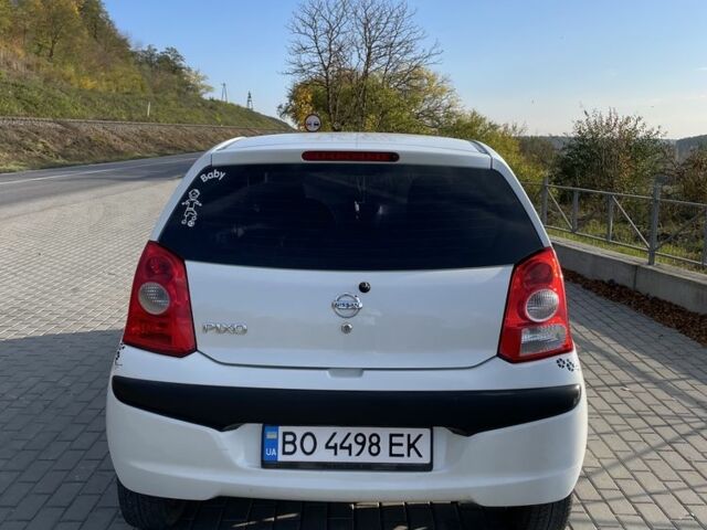 Белый Ниссан Пиксо, объемом двигателя 1 л и пробегом 208 тыс. км за 3500 $, фото 12 на Automoto.ua