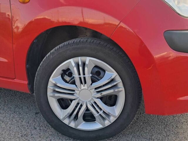 Красный Ниссан Пиксо, объемом двигателя 1 л и пробегом 180 тыс. км за 3850 $, фото 5 на Automoto.ua