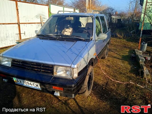 Синій Ніссан Прерія, об'ємом двигуна 2 л та пробігом 100 тис. км за 1100 $, фото 1 на Automoto.ua