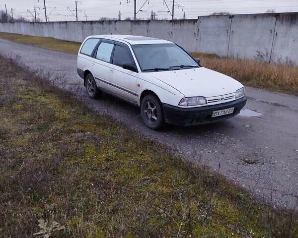 Білий Ніссан Прімера, об'ємом двигуна 2 л та пробігом 409 тис. км за 1200 $, фото 3 на Automoto.ua