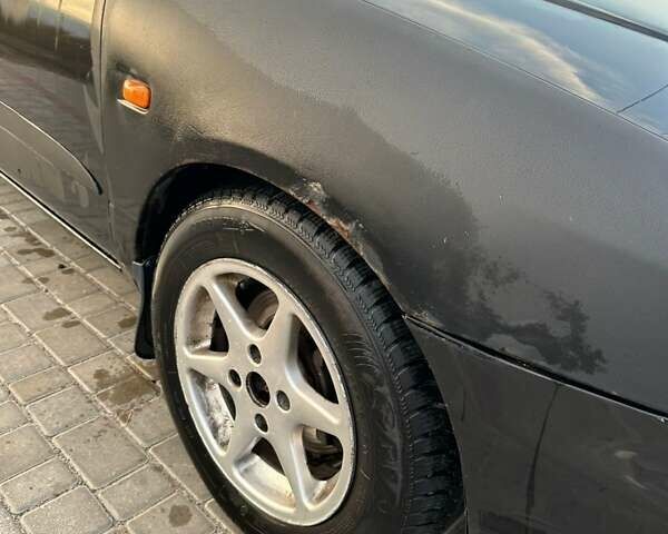 Черный Ниссан Примера, объемом двигателя 1.77 л и пробегом 375 тыс. км за 1800 $, фото 11 на Automoto.ua