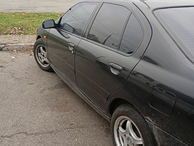 Черный Ниссан Примера, объемом двигателя 1.6 л и пробегом 199 тыс. км за 1900 $, фото 1 на Automoto.ua