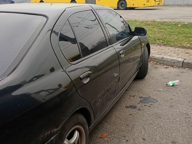 Черный Ниссан Примера, объемом двигателя 1.6 л и пробегом 199 тыс. км за 1900 $, фото 3 на Automoto.ua