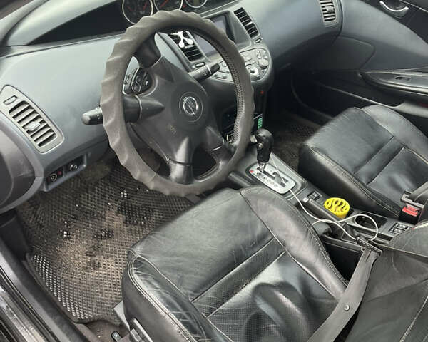 Черный Ниссан Примера, объемом двигателя 2 л и пробегом 297 тыс. км за 3150 $, фото 10 на Automoto.ua