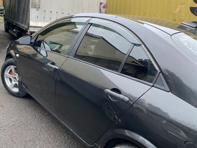 Черный Ниссан Примера, объемом двигателя 2 л и пробегом 150 тыс. км за 4300 $, фото 1 на Automoto.ua