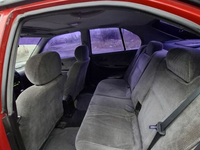 Красный Ниссан Примера, объемом двигателя 2 л и пробегом 323 тыс. км за 2300 $, фото 1 на Automoto.ua