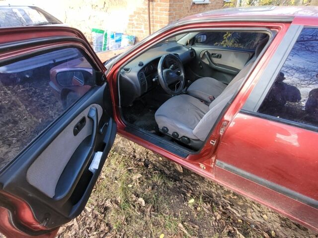 Красный Ниссан Примера, объемом двигателя 1.6 л и пробегом 200 тыс. км за 2000 $, фото 6 на Automoto.ua