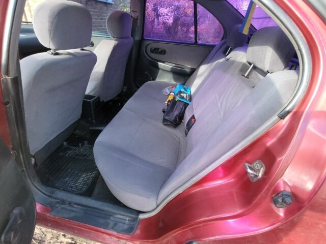 Красный Ниссан Примера, объемом двигателя 1.6 л и пробегом 200 тыс. км за 2000 $, фото 3 на Automoto.ua