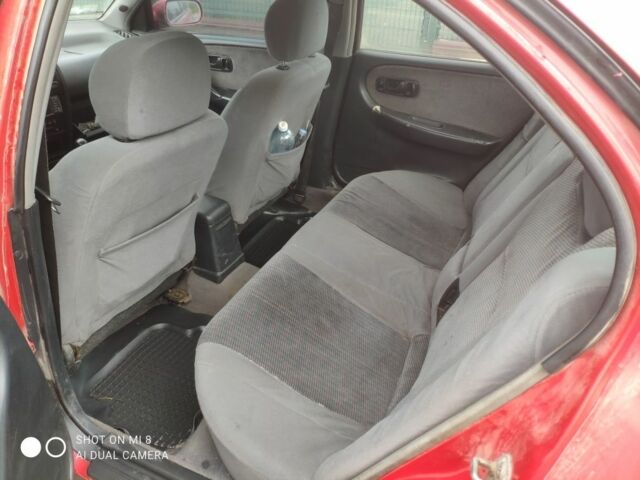 Красный Ниссан Примера, объемом двигателя 1.6 л и пробегом 244 тыс. км за 670 $, фото 5 на Automoto.ua