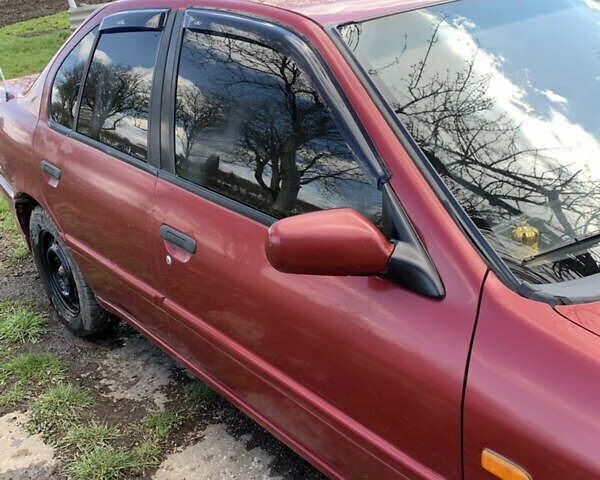 Красный Ниссан Примера, объемом двигателя 2 л и пробегом 329 тыс. км за 1800 $, фото 4 на Automoto.ua