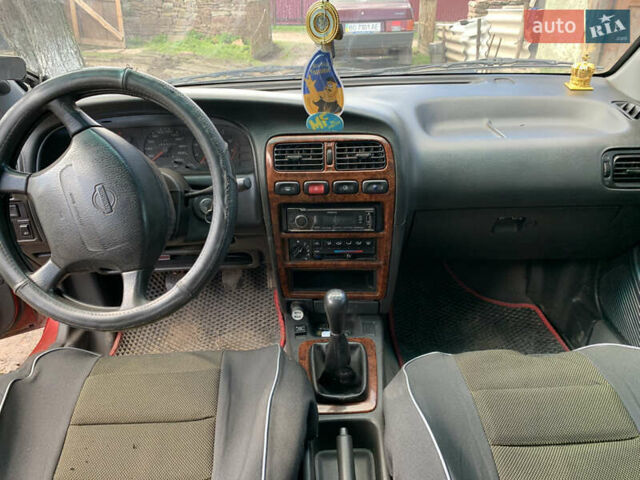 Красный Ниссан Примера, объемом двигателя 2 л и пробегом 329 тыс. км за 1800 $, фото 1 на Automoto.ua