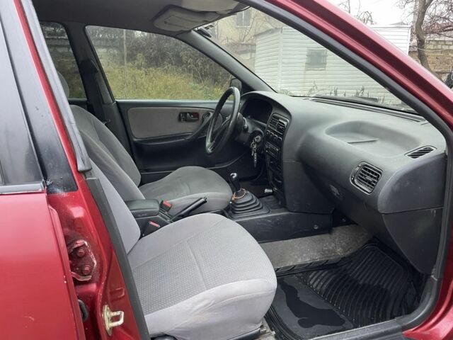 Червоний Ніссан Прімера, об'ємом двигуна 2 л та пробігом 400 тис. км за 1199 $, фото 10 на Automoto.ua