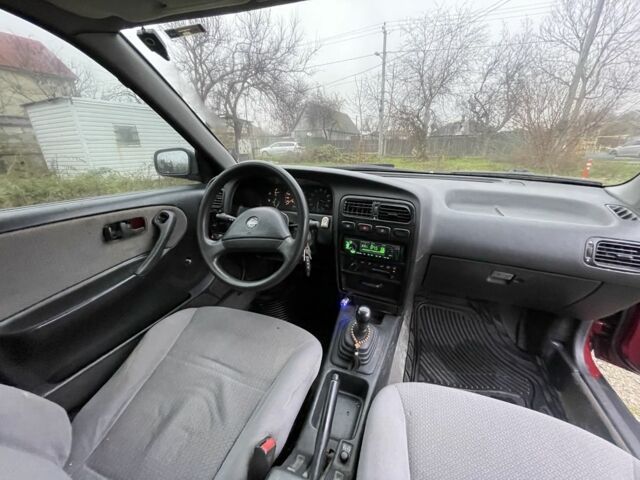 Червоний Ніссан Прімера, об'ємом двигуна 2 л та пробігом 400 тис. км за 1199 $, фото 12 на Automoto.ua