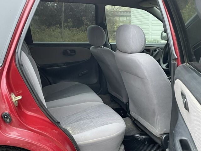 Червоний Ніссан Прімера, об'ємом двигуна 2 л та пробігом 400 тис. км за 1199 $, фото 11 на Automoto.ua