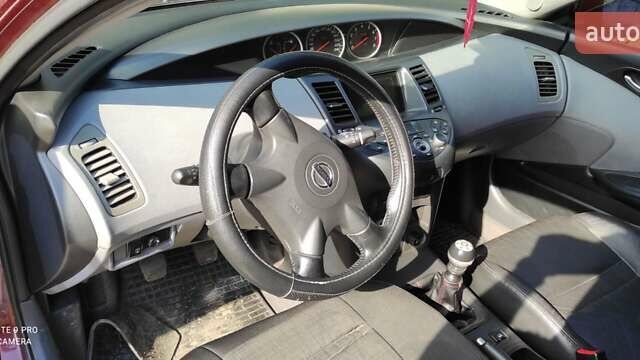 Красный Ниссан Примера, объемом двигателя 2 л и пробегом 235 тыс. км за 3600 $, фото 4 на Automoto.ua