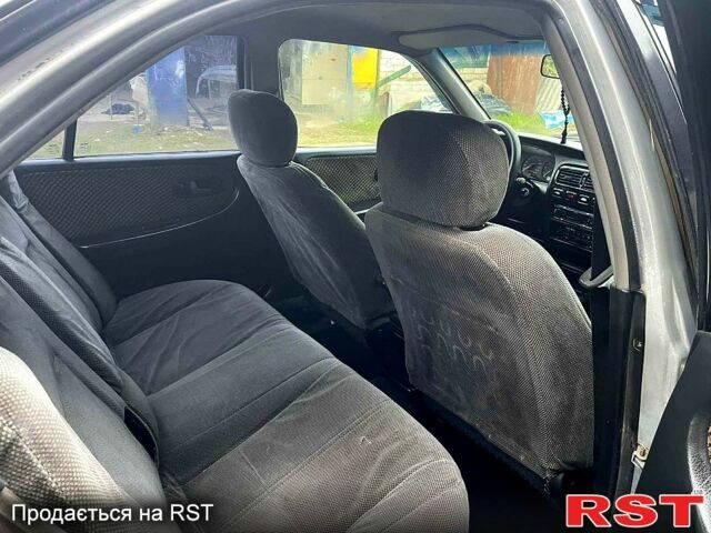 Сірий Ніссан Прімера, об'ємом двигуна 2 л та пробігом 268 тис. км за 1600 $, фото 6 на Automoto.ua