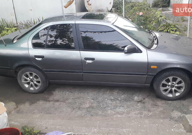Сірий Ніссан Прімера, об'ємом двигуна 1.6 л та пробігом 340 тис. км за 2100 $, фото 9 на Automoto.ua