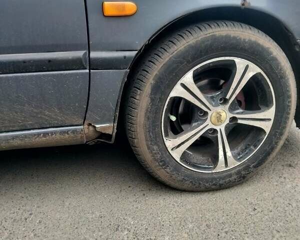 Серый Ниссан Примера, объемом двигателя 1.6 л и пробегом 274 тыс. км за 1900 $, фото 3 на Automoto.ua