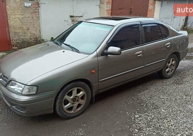 Серый Ниссан Примера, объемом двигателя 2 л и пробегом 332 тыс. км за 2150 $, фото 12 на Automoto.ua