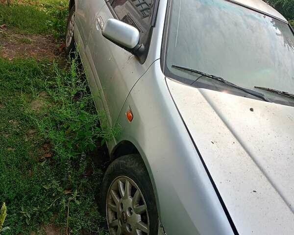 Серый Ниссан Примера, объемом двигателя 2 л и пробегом 319 тыс. км за 1200 $, фото 2 на Automoto.ua