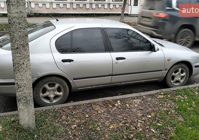 Сірий Ніссан Прімера, об'ємом двигуна 2 л та пробігом 350 тис. км за 2000 $, фото 4 на Automoto.ua