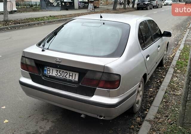 Сірий Ніссан Прімера, об'ємом двигуна 2 л та пробігом 350 тис. км за 2000 $, фото 3 на Automoto.ua