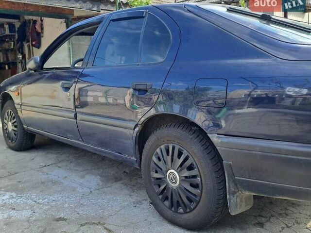 Синій Ніссан Прімера, об'ємом двигуна 1.6 л та пробігом 323 тис. км за 1000 $, фото 12 на Automoto.ua