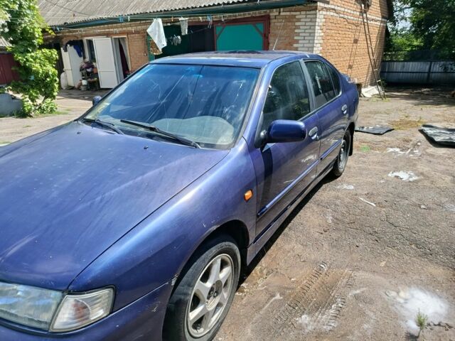 Синий Ниссан Примера, объемом двигателя 2 л и пробегом 300 тыс. км за 1800 $, фото 2 на Automoto.ua