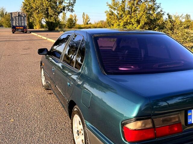 Зелений Ніссан Прімера, об'ємом двигуна 1.6 л та пробігом 405 тис. км за 2000 $, фото 1 на Automoto.ua