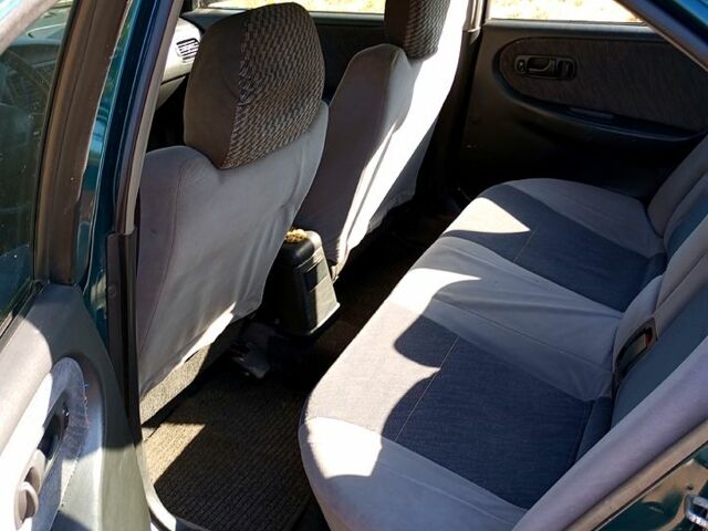 Зелений Ніссан Прімера, об'ємом двигуна 1.6 л та пробігом 400 тис. км за 1400 $, фото 4 на Automoto.ua