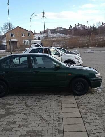 Зеленый Ниссан Примера, объемом двигателя 2 л и пробегом 397 тыс. км за 1800 $, фото 5 на Automoto.ua