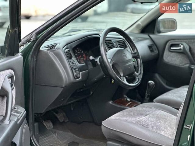 Зелений Ніссан Прімера, об'ємом двигуна 2 л та пробігом 263 тис. км за 1999 $, фото 6 на Automoto.ua