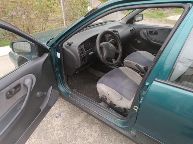 Зелений Ніссан Прімера, об'ємом двигуна 1.6 л та пробігом 225 тис. км за 1499 $, фото 14 на Automoto.ua