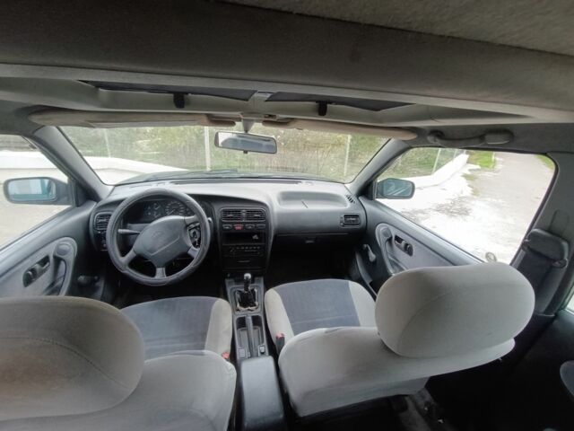 Зелений Ніссан Прімера, об'ємом двигуна 1.6 л та пробігом 225 тис. км за 1499 $, фото 18 на Automoto.ua