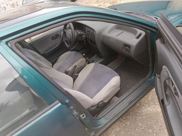 Зелений Ніссан Прімера, об'ємом двигуна 1.6 л та пробігом 225 тис. км за 1499 $, фото 5 на Automoto.ua