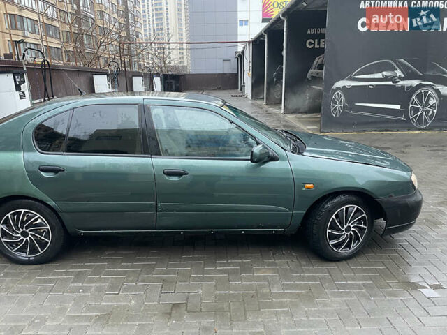 Зелений Ніссан Прімера, об'ємом двигуна 1.8 л та пробігом 295 тис. км за 2200 $, фото 6 на Automoto.ua