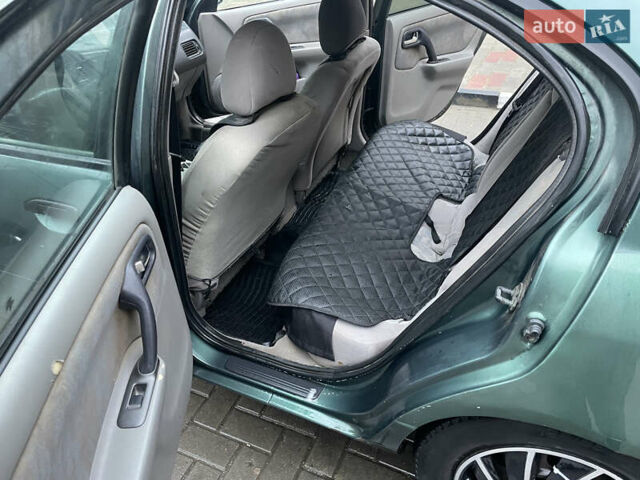 Зелений Ніссан Прімера, об'ємом двигуна 1.8 л та пробігом 295 тис. км за 2200 $, фото 8 на Automoto.ua