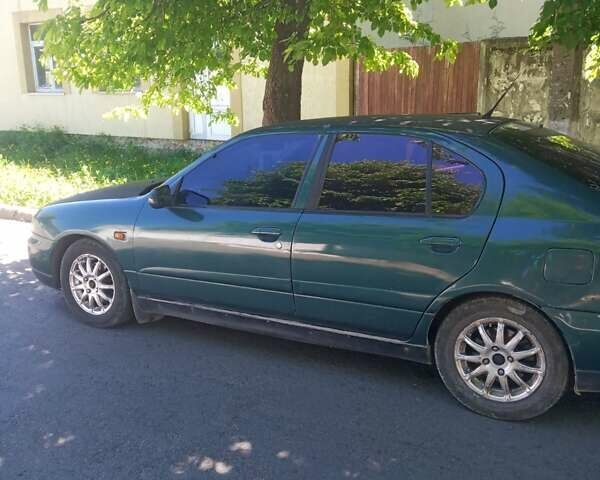 Зелений Ніссан Прімера, об'ємом двигуна 2 л та пробігом 380 тис. км за 2000 $, фото 1 на Automoto.ua