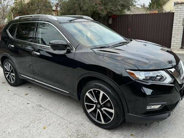 Черный Ниссан Rogue, объемом двигателя 2.5 л и пробегом 100 тыс. км за 12000 $, фото 1 на Automoto.ua