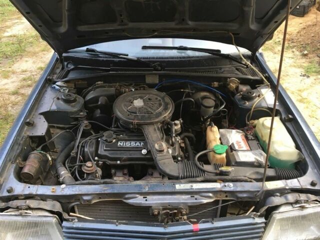 Синий Ниссан Станза, объемом двигателя 1.8 л и пробегом 214 тыс. км за 500 $, фото 7 на Automoto.ua