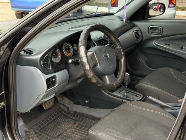 Чорний Ніссан Санні, об'ємом двигуна 1.6 л та пробігом 250 тис. км за 5400 $, фото 6 на Automoto.ua