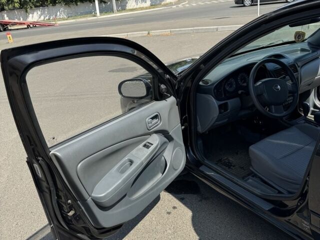 Черный Ниссан Санни, объемом двигателя 1.6 л и пробегом 195 тыс. км за 4200 $, фото 7 на Automoto.ua