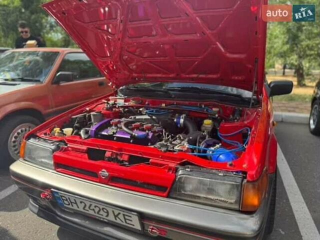 Красный Ниссан Санни, объемом двигателя 1.81 л и пробегом 300 тыс. км за 19999 $, фото 2 на Automoto.ua