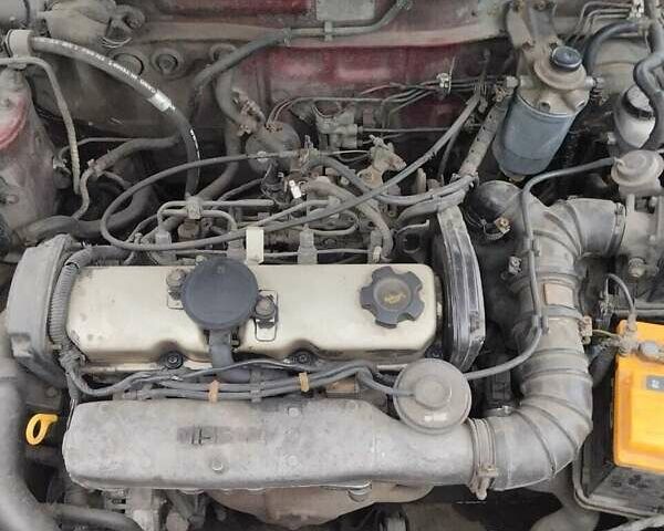 Червоний Ніссан Санні, об'ємом двигуна 2 л та пробігом 692 тис. км за 1902 $, фото 5 на Automoto.ua