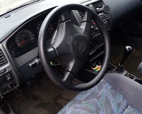 Серый Ниссан Санни, объемом двигателя 1.4 л и пробегом 370 тыс. км за 950 $, фото 10 на Automoto.ua