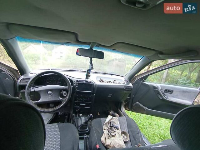 Серый Ниссан Санни, объемом двигателя 1.6 л и пробегом 303 тыс. км за 450 $, фото 9 на Automoto.ua