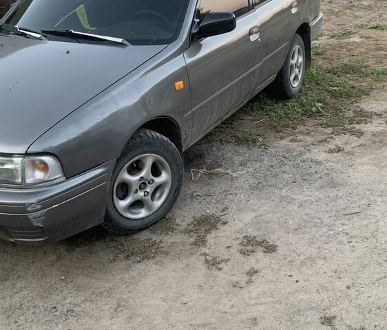 Серый Ниссан Санни, объемом двигателя 2 л и пробегом 450 тыс. км за 1000 $, фото 1 на Automoto.ua