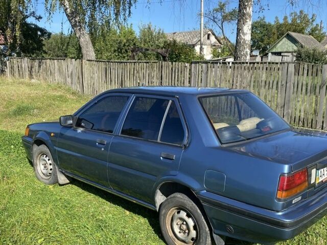 Синій Ніссан Санні, об'ємом двигуна 1.4 л та пробігом 250 тис. км за 673 $, фото 1 на Automoto.ua