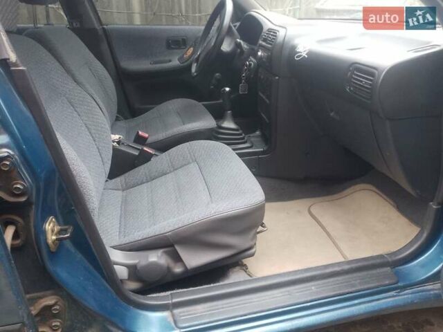 Синий Ниссан Санни, объемом двигателя 1.39 л и пробегом 325 тыс. км за 1350 $, фото 2 на Automoto.ua