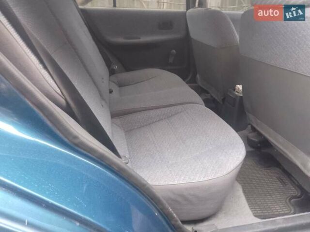 Синий Ниссан Санни, объемом двигателя 1.39 л и пробегом 325 тыс. км за 1350 $, фото 4 на Automoto.ua